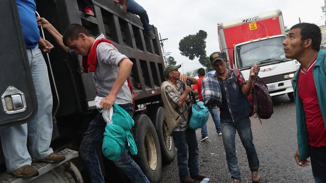 Central Americans in a migrant caravan hitchhike and walk through Guatemala towards the border with Mexico. Picture: Getty Images