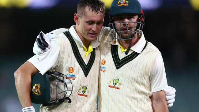 Marnus Labuschagne and Travis Head walk from the field at the end of play on a day of pure dominance for the Aussies. Picture: Chris Hyde/Getty Images