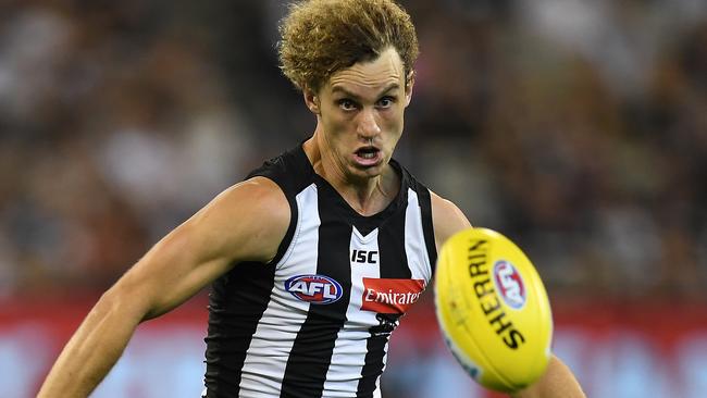 Chris Mayne attacks the ball in the Round 1 game between Collingwood and the Western Bulldogs at the MCG. Picture: AAP