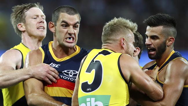 Nick Riewoldt, Taylor Walker, Brandon Ellis and Wayne Milera tussle at Adelaide Oval on Thursday night. Picture SARAH REED