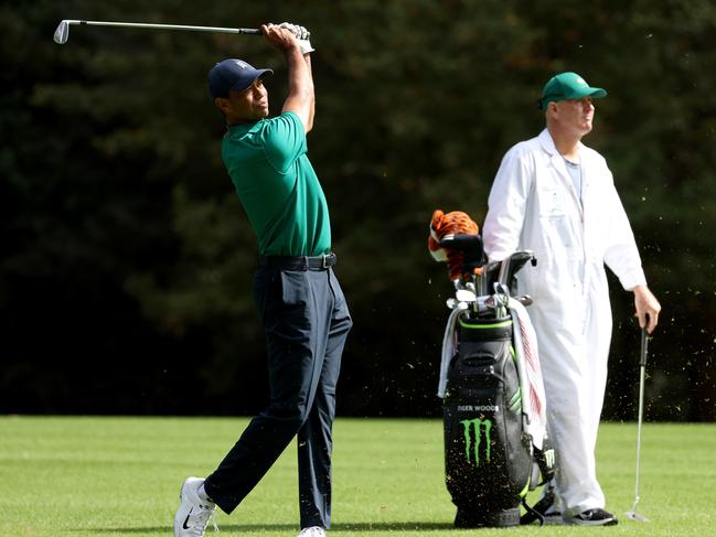 AUGUSTA, GEORGIA - NOVEMBER 09:  Tiger Woods of the United States plays a shot on the 11th hole as caddie Joe LaCava looks on during a practice round prior to the Masters at Augusta National Golf Club on November 09, 2020 in Augusta, Georgia. (Photo by Jamie Squire/Getty Images)