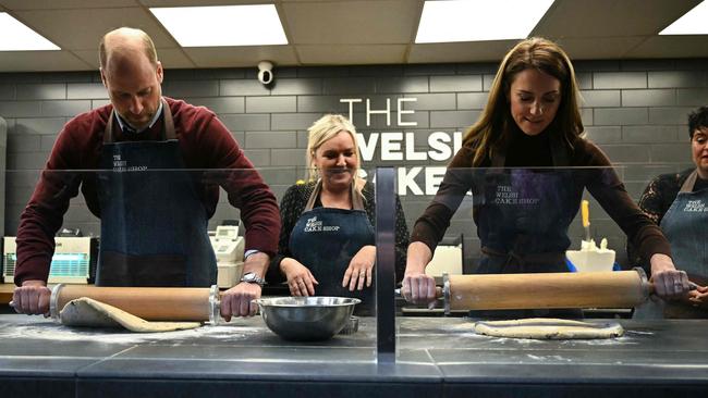 Prince William, Prince of Wales and Catherine, Princess of Wales roll out Welsh Cakes, watched by Theresa Connor at The Welsh Cake Shop, during a visit to Pontypridd Market. Picture: AFP