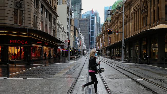 A lone woman on George Street in Sydney’s CBD. Picture: NCA NewsWire / Gaye Gerard