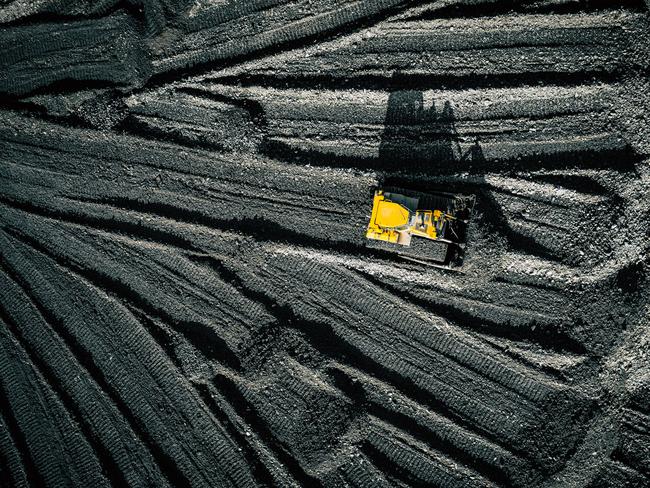 Open pit mine. Aerial view of extractive industry for coal. Top view. Photo captured with drone.