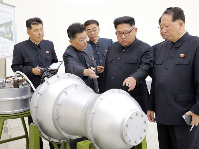 Kim Jong-Un is shown looking at a metal casing purported to be a mock-up of a nuclear warhead capable of being fitted to a ballistic missile. North Korea recently tested a device with a yield of around 160 kilotons — more than ten times the size of the Hiroshima bomb. Picture: KCNA via KNS