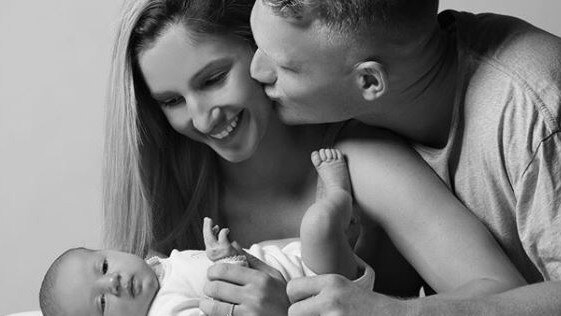 Adam Treloar with fiancee Kim and daughter Georgie. Source: Instagram