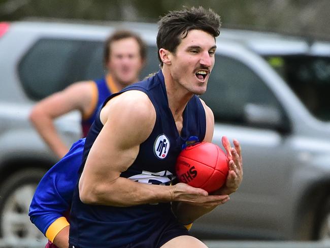 NFL footy: Epping V South Morang. Epping's Aaron Willitts marks in front of Sth Morang's Daniel Watson.