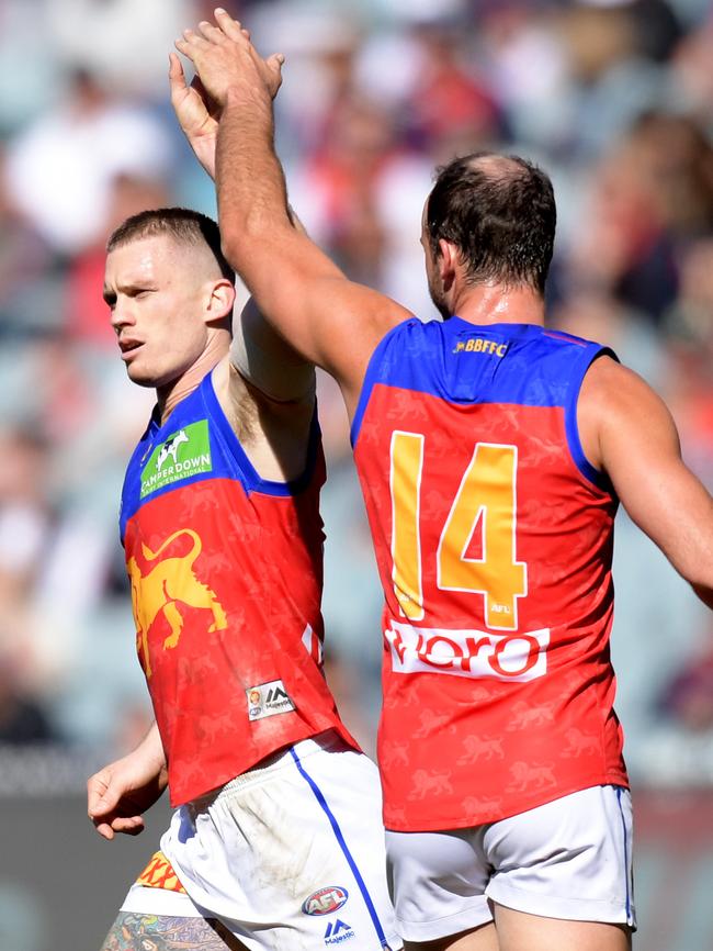 Dayne Beams celebrates a goal with Josh Walker.