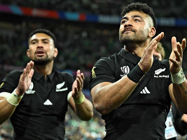 Mew Zealand players celebrate after they won the France 2023 Rugby World Cup quarter-final match between Ireland and New Zealand at the Stade de France in Saint-Denis, on the outskirts of Paris, on October 14, 2023. (Photo by JULIEN DE ROSA / AFP)