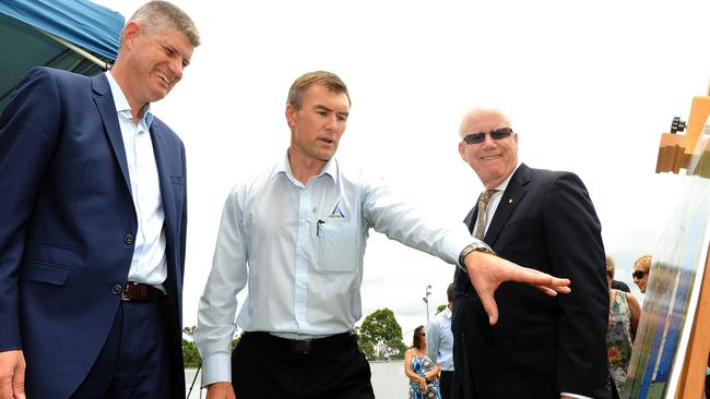 Commonwealth Games Minister Stirling Hinchliffe, Alder Constructions general manager Dean Cheffers and Games Corporation chairman Nigel Chamier inspect plans for the Gold Coast Hockey Centre. Picture: John Gass