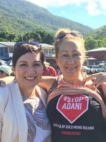 Queensland Environment Minister Leeanne Enoch talks to an anti Adani protester in Cairns.