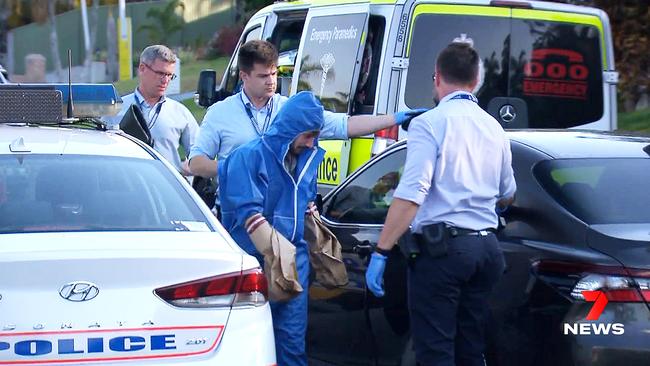 Ch7 still of Ryan Bayldon-Lumsden being taken away by police outside his home.