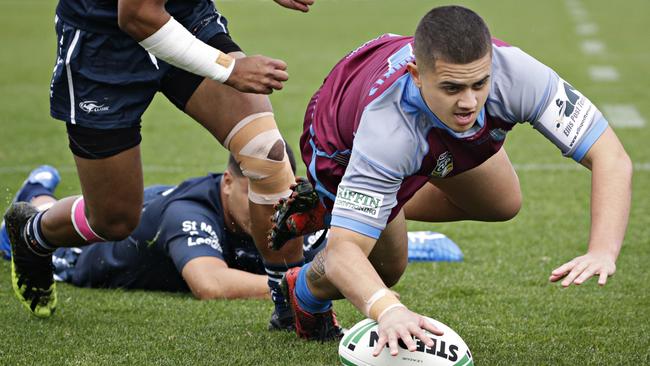 Drew Lloyd scores a try for Hills Sports High. Picture: Adam Yip