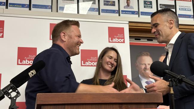 Labor by-election winner Alex Dighton arrives at his victory party at the Cobra Football Club with his family and Premier Peter Malinauskas.