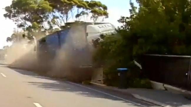 The DTL Timbers truck smashed through a bus stop and fences on Hampstead Road, Adelaide. Picture: 9News/Channel 9