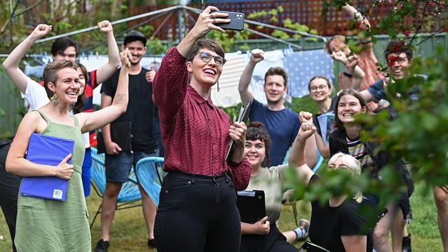 Amy MacMahon, centre, the Greens candidate for South Brisbane, in Woolloongabba, Brisbane, on Sunday. Picture: Lyndon Mechielsen