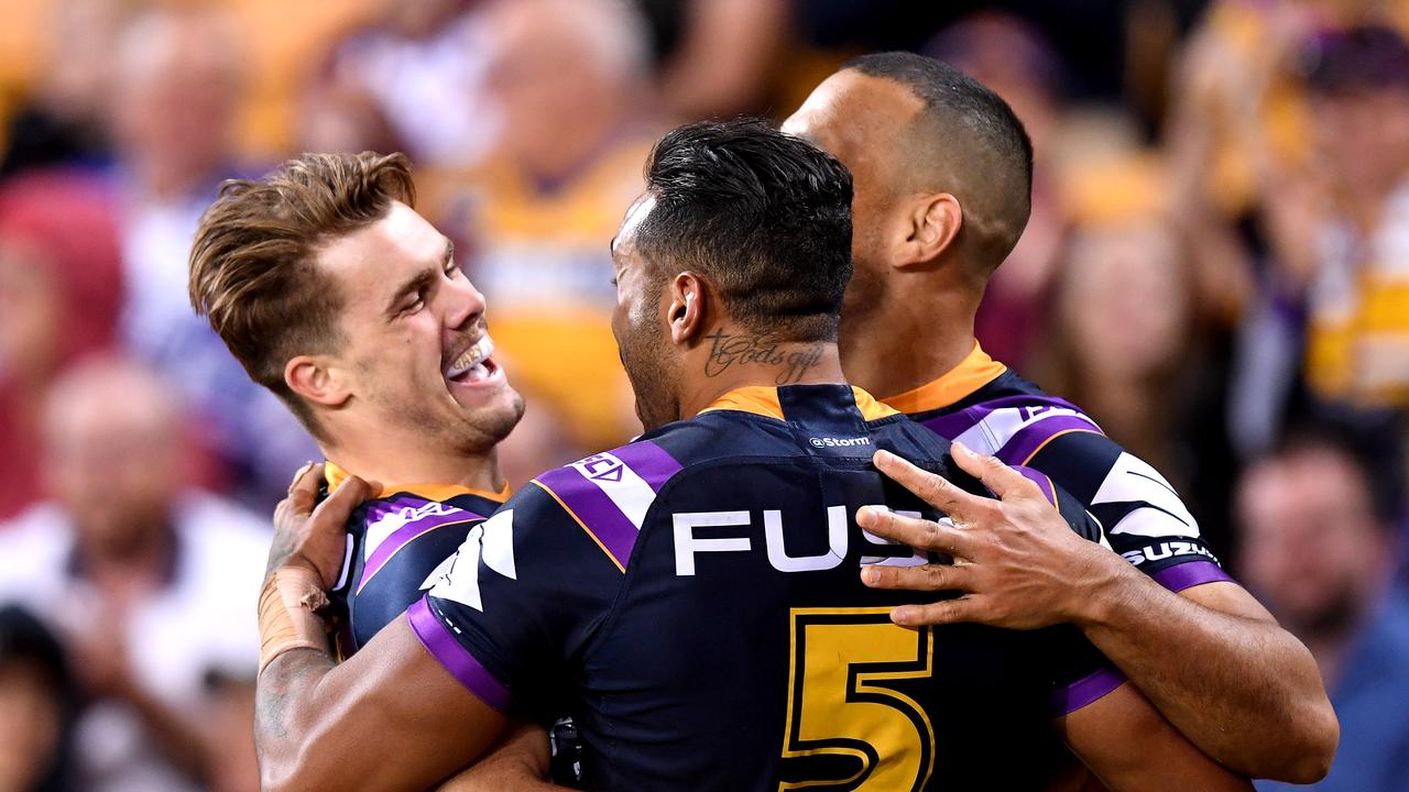 Ryan Papenhuyzen of the Storm celebrates scoring a try.