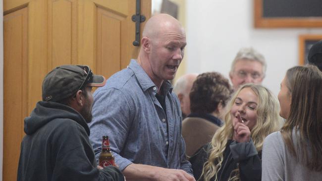 AFL football star Barry Hall talks with locals after giving a talk at the Eudunda Club, 110km north of Adelaide, on Saturday night.