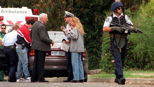 Police search a street in Christie Downs, following a report that escaped prisoner Anthony Smith was there.