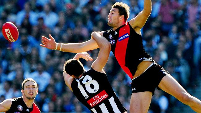 Tom Bellchambers steamrolled Darren Jolly in the first bounce of the 2011 Anzac Day game. Picture: Colleen Petch