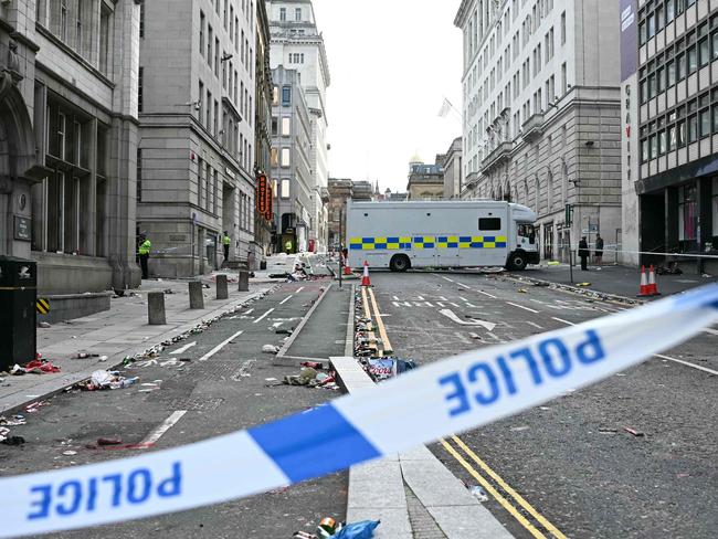 Police officers stand at a cordon on in Water Street in Liverpool, where the incident happened. Picture: AFP