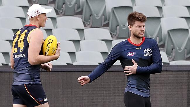 Adelaide Crows training at Adelaide Oval. Bryce Gibbs with Sam Jacobs walking past. Picture SARAH REED