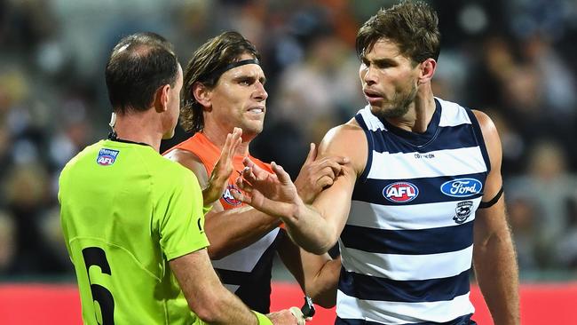 Tom Hawkins pushed umpire Dean Margetts’ arm away. Picture: Getty