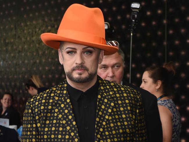 Boy George of Culture Club avoids the red carpet by sneaking in behind photographers at the ACTAA Awards. Picture: AAP