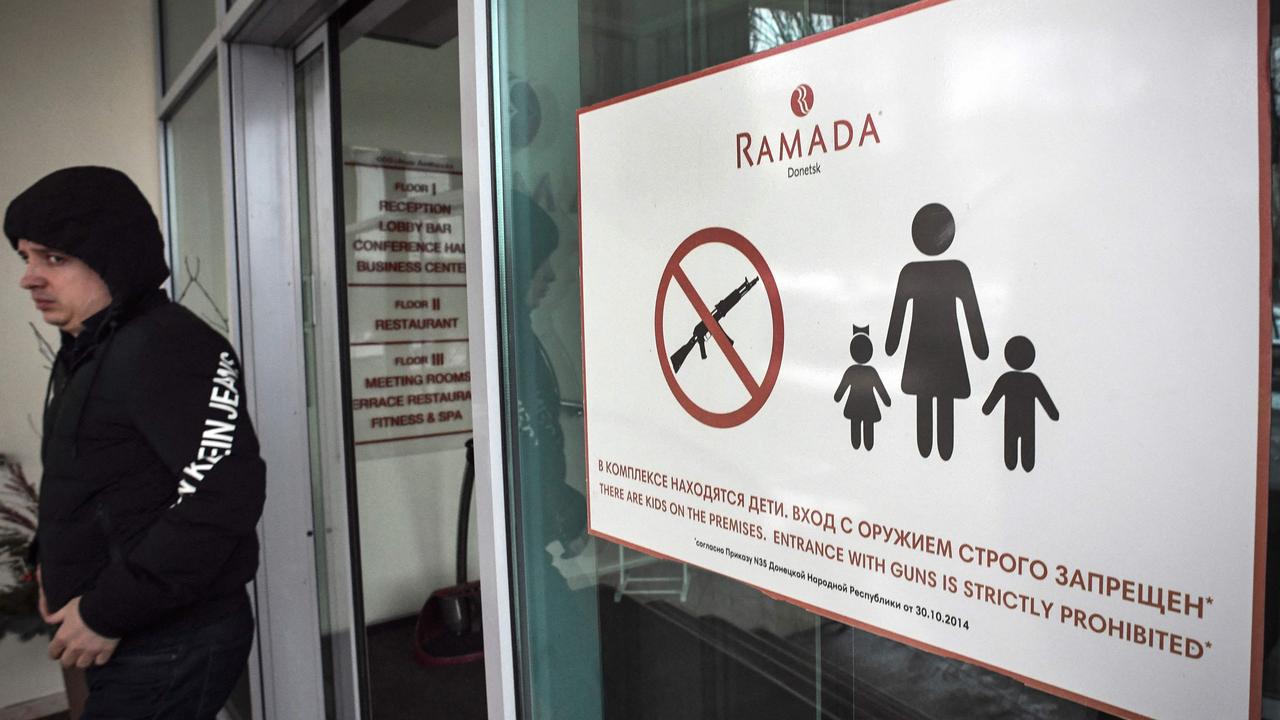 A warning prohibiting weapons inside a hotel in central Donetsk, eastern Ukraine, the capital of a self-proclaimed Donetsk People’s Republic. Picture: Alexander Nemenov/AFP