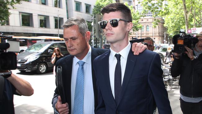 Benjamin Fitt (right) leaves the Melbourne Magistrate Court. Picture: AAP/David Crosling