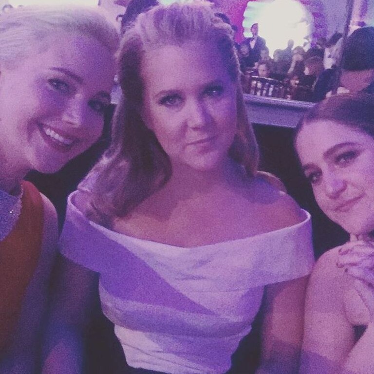 Amy Schumer with Jennifer Lawrence and Kim Caramele ... "So happy for our friend." Picture: Instagram