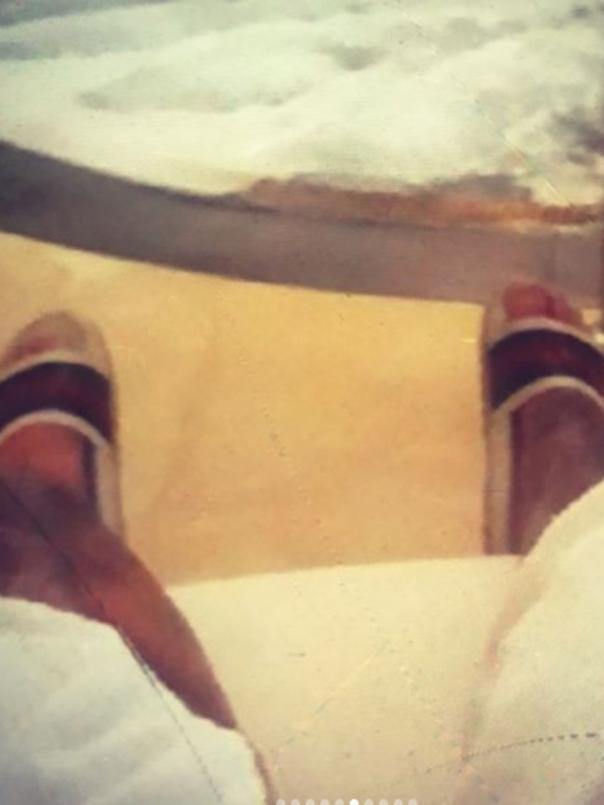 Relaxing by the water in designer sandals. Picture: Instagram