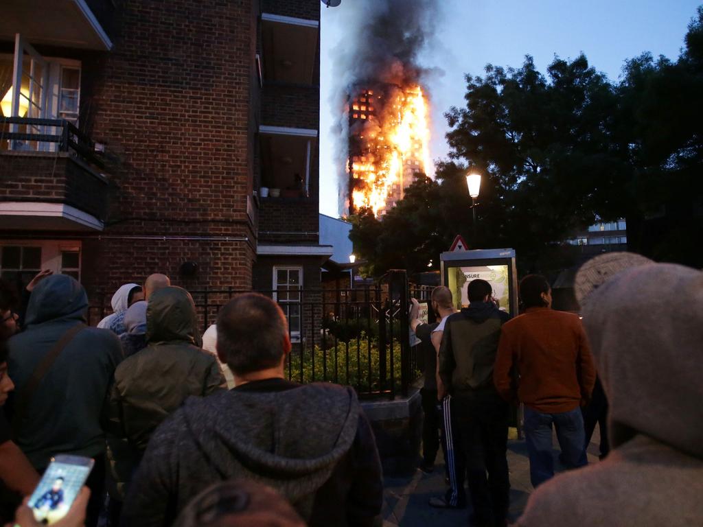 Local residents watch in horror as Grenfell Tower is engulfed by fire. Picture: AFP Photo/Daniel Leal-Olivas