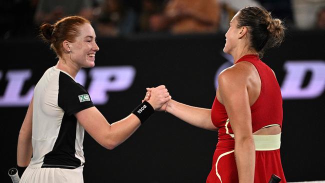 Aryna Sabalenka (R) greets Ella Seidel after the pair’s late-night match on Sunday night. Picture: Anthony Wallace/AFP.