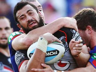 Sunday Telegraph. NRL Round 1; Newcastle Knights v New Zealand Warriors, played at Hunter Stadium in Newcastle. Warriors' Ben Matulino wrapped up in a tackle.