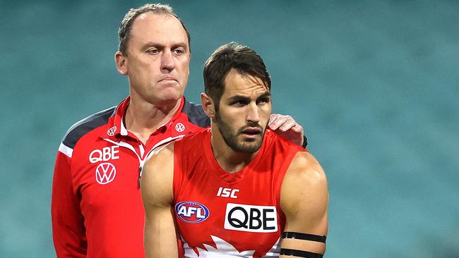 Coach John Longmire consoles Josh Kennedy in game number 250 after a moment’s silence in the memory of his grandfather John Kennedy Sr who passed away last Thursday ahead of the AFL match between the Sydney Swans and Western Bulldogs at the SCG. Picture. Phil Hillyard