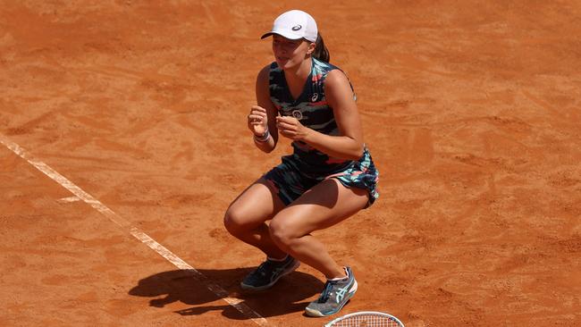 Iga Swiatek crumples to the clay after beating Ons Jabeur to win the Italian Open