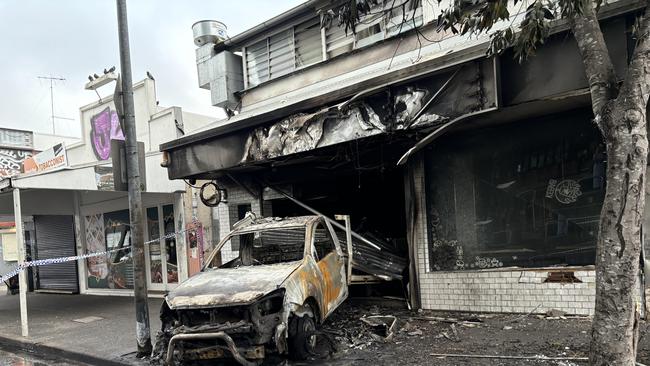 Police at the scene after a ute was ram raided into West End business Shisha Bar then set it on fire, Boundary St, West End. Picture: Molly Snaylam