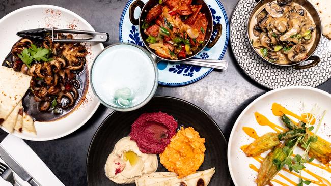 Clockwise from left: Baby octopus, the chorizo plate, pan fried mushroom saute, zucchini flowers, hummus, beetroot and carrot dip make up quite the feast. Picture: Monique Harmer