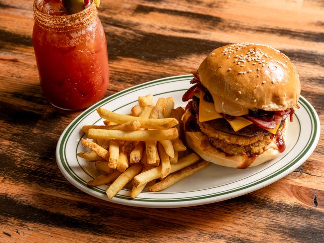 Double beef burger is piled high with all the trimmings— shame it was cold. Picture: Sam Schultz.