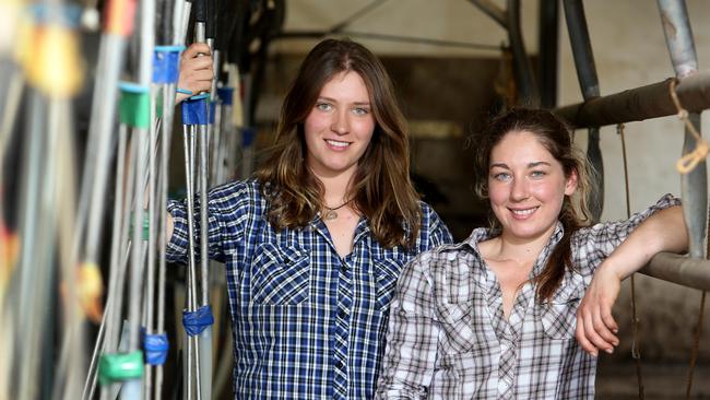 Caroline and Sophia Jones in the dairy at Longwarry North, in West Gippsland. Picture: Yuri Kouzmin