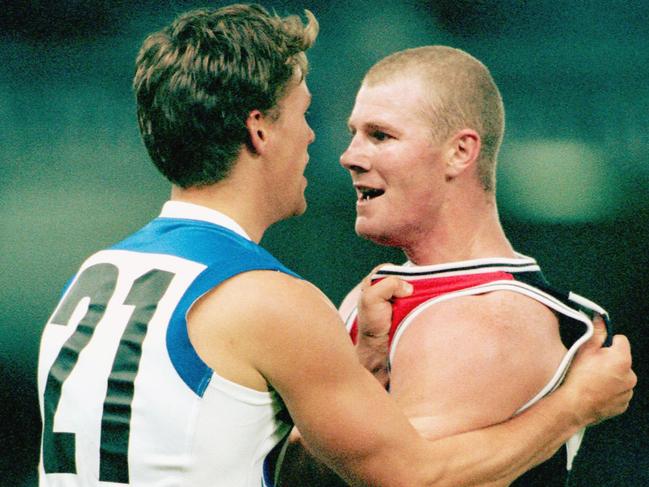 Hall and North Melbourne’s Evan Hewitt go toe-to-toe.