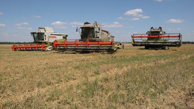 Ukrainian farmers harvest grain about 220km north of Kyiv in the years before the invasion. Picture: AFP