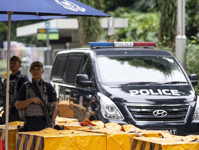 Gurkha police officers stand guard outside the St. Regis Hotel in Singapore. Picture: AP/Yong Teck Lim