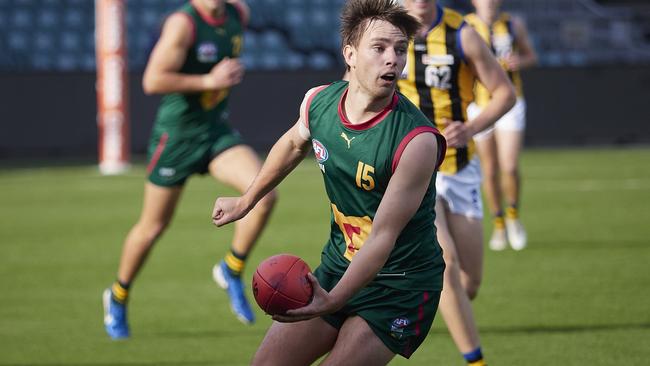 Baxter Norton looks to handball during Tasmania’s clash with Sandringham. Picture: Rod Thompson