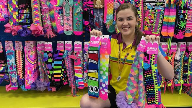 Toyworld Rockhampton staff member Sophie Fletchett with the Madmia socks, which have also been selling like hotcakes.