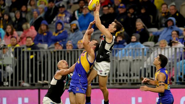 HIGH FLYER: Port Adelaide’s Connor Rozee takes a strong mark over West Coast captain Shannon Hurn in the Power’s round five win in Perth. Picture: RICHARD WAINWRIGHT (AAP).