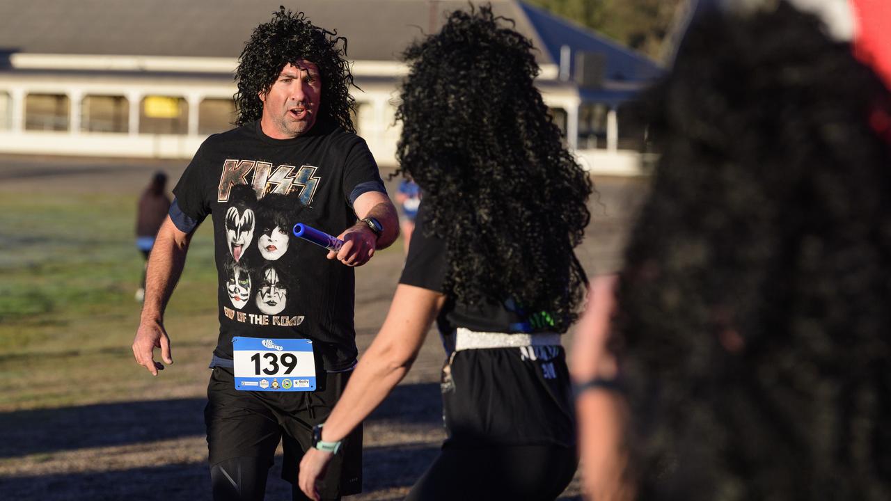 Andrew Moyler hands the baton on for team Kiss in the 40 for Fortey relay at Toowoomba Showgrounds, Sunday, June 8, 2025. Picture: Kevin Farmer