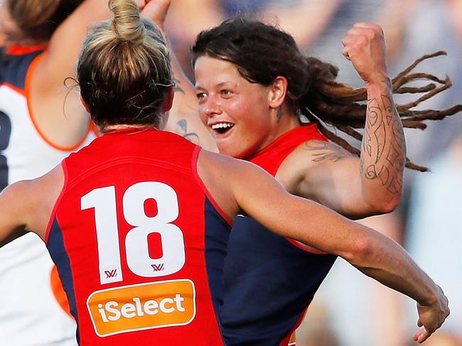 MELBOURNE, AUSTRALIA - FEBRUARY 03:  Richelle Cranston of the Demons is congratulated by her teammates after kicking the match-winning goal during the round one AFLW match between the Melbourne Demons and the Greater Western Sydney Giants at Casey Fields on February 3, 2018 in Melbourne, Australia.  (Photo by Scott Barbour/Getty Images)