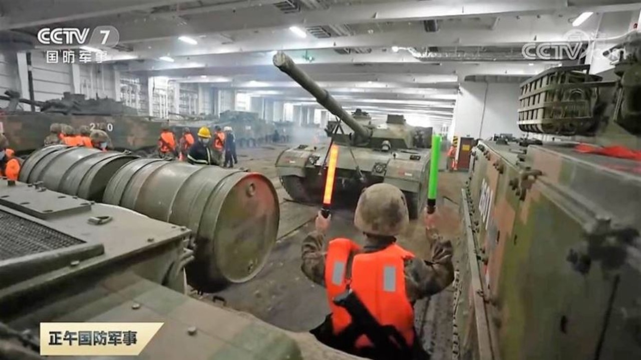 Chinese main battle tanks are seen being loaded aboard the commercial RO-RO ferry Zhong Hua Fu Zing. Picture: CCTV7